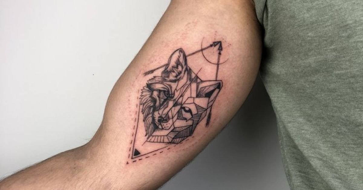Wolf inner bicep tattoo